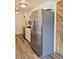 Spacious kitchen featuring stainless steel appliances and wood-look floors at 3225 S Garrison St # 19, Lakewood, CO 80227