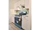 Modern kitchen equipped with stainless steel appliances and blue accents at 3225 S Garrison St # 19, Lakewood, CO 80227