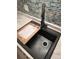 Kitchen sink featuring a cutting board and modern faucet at 3225 S Garrison St # 19, Lakewood, CO 80227