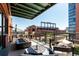 Enjoy city views from this balcony with a fire pit and seating, perfect for entertaining at 1735 19Th St # 6D, Denver, CO 80202