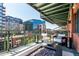 Relaxing balcony featuring comfortable seating and a modern fire pit with views of downtown at 1735 19Th St # 6D, Denver, CO 80202