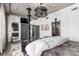 Contemporary bedroom featuring a four-poster bed, decorative mirror, and ample closet space at 1735 19Th St # 6D, Denver, CO 80202