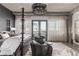 Bedroom featuring a distinctive four-poster bed, chandelier, and access to a private balcony at 1735 19Th St # 6D, Denver, CO 80202