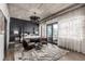 Modern bedroom with a stylish chandelier, unique rug, and private balcony with views at 1735 19Th St # 6D, Denver, CO 80202
