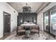 Cozy bedroom with a decorative chandelier, accent wall, and chairs for a quiet moment at 1735 19Th St # 6D, Denver, CO 80202