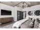 Modern bedroom featuring a uniquely designed dresser, TV, and a sliding closet door at 1735 19Th St # 6D, Denver, CO 80202