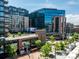Vibrant city view from a building highlighting urban architecture, lush greenery, and lively street scenes at 1735 19Th St # 6D, Denver, CO 80202