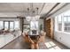 Bright dining area showcasing modern chandeliers, light wood floors, and an open layout at 1735 19Th St # 6D, Denver, CO 80202