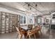 Stylish dining area featuring modern lighting fixtures, open layout, and light wood floors at 1735 19Th St # 6D, Denver, CO 80202