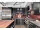 Gourmet kitchen with stainless steel appliances, and black cabinetry at 1735 19Th St # 6D, Denver, CO 80202