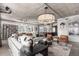Well-lit living room features open design with concrete ceiling and modern fixtures at 1735 19Th St # 6D, Denver, CO 80202