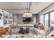 Stylish living room with modern decor, textured accent wall and contemporary lighting at 1735 19Th St # 6D, Denver, CO 80202