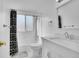 Clean bathroom featuring a shower-tub combo and modern fixtures, with a bright, minimalist design at 7891 Allison Way # 201, Arvada, CO 80005