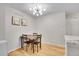 Cozy dining area features a modern light fixture and seating for four at 7891 Allison Way # 201, Arvada, CO 80005