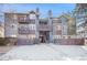Attractive condo complex featuring multiple levels, private balconies, and well-kept grounds at 7891 Allison Way # 201, Arvada, CO 80005