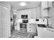Beautiful kitchen with stainless steel appliances, white cabinets and custom backsplash at 7891 Allison Way # 201, Arvada, CO 80005