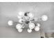 Close up of a modern light fixture with many spherical bulbs attached to a central base at 7891 Allison Way # 201, Arvada, CO 80005