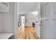 Open-concept living space with beautiful hardwood floors and modern lighting fixtures at 7891 Allison Way # 201, Arvada, CO 80005