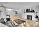 Spacious living area with hardwood floors, a fireplace, and an open layout at 7891 Allison Way # 201, Arvada, CO 80005