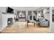 Charming living room with a fireplace, hardwood floors, and stylish furnishings at 7891 Allison Way # 201, Arvada, CO 80005