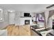 Inviting living room with a fireplace, hardwood floors, and a comfortable seating area at 7891 Allison Way # 201, Arvada, CO 80005