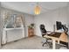 Well-lit office space featuring a modern desk, comfortable chair, and bright window at 7891 Allison Way # 201, Arvada, CO 80005