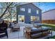 Well-maintained backyard featuring a cozy patio area, modern patio furniture, and a barbecue grill at 317 Bonanza Dr, Erie, CO 80516