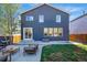 Charming backyard with a concrete patio and comfortable seating area for outdoor relaxation at 317 Bonanza Dr, Erie, CO 80516