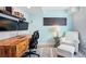 Home office features a wood desk, a comfortable chair, and stylish decor, offering a productive and inviting workspace at 317 Bonanza Dr, Erie, CO 80516