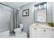 This bathroom boasts a tub-shower combo and vanity with a vessel sink, offering a functional and modern space at 317 Bonanza Dr, Erie, CO 80516