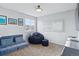 Comfortable bedroom with a large window, beanbag chair, and unique wall decorations at 317 Bonanza Dr, Erie, CO 80516