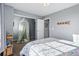 Inviting bedroom featuring a floral comforter, sheer canopy, and natural light, creating a relaxing and stylish space at 317 Bonanza Dr, Erie, CO 80516