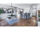 Open-concept dining area showcasing a modern table and chairs, seamlessly connecting to the kitchen at 317 Bonanza Dr, Erie, CO 80516