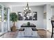Bright dining area boasts modern lighting and a charming table with built-in bench seating at 317 Bonanza Dr, Erie, CO 80516