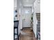 Open-concept entry boasts slate floors, white trim, and a carpeted staircase at 317 Bonanza Dr, Erie, CO 80516