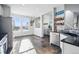 Bright and airy kitchen space with an adjacent dining area, boasting modern stainless steel appliances at 317 Bonanza Dr, Erie, CO 80516