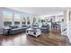Open-concept living room seamlessly integrates comfort and style, with easy access to the dining area and kitchen at 317 Bonanza Dr, Erie, CO 80516