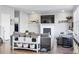 Cozy living room showcases a fireplace, comfortable seating, and rustic-chic decor for a warm ambiance at 317 Bonanza Dr, Erie, CO 80516