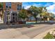 A vibrant street view featuring local shops, trees, and charming pedestrian features at 317 Bonanza Dr, Erie, CO 80516