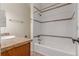 Bathroom with tub, shower, tile accents, and vanity at 1030 Jersey St # 1, Denver, CO 80220