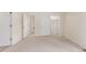 Bedroom with neutral carpet and multiple doors at 1030 Jersey St # 1, Denver, CO 80220