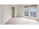 Bedroom with neutral carpet, large windows, and closet at 1030 Jersey St # 1, Denver, CO 80220