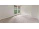 Spacious bedroom with neutral carpet and large windows offering ample natural light at 1030 Jersey St # 1, Denver, CO 80220