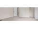 Bedroom with neutral carpet, multiple doors, and closet at 1030 Jersey St # 1, Denver, CO 80220