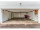 Spacious garage with white walls, concrete floor, and ample room for parking and storage at 1030 Jersey St # 1, Denver, CO 80220