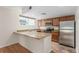 Modern kitchen with stainless steel appliances and granite countertops at 1030 Jersey St # 1, Denver, CO 80220