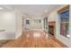 Bright living room with fireplace, large windows, and hardwood floors at 1030 Jersey St # 1, Denver, CO 80220