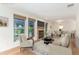 Inviting living room featuring a cozy fireplace, large windows and gorgeous wood flooring throughout at 1030 Jersey St # 1, Denver, CO 80220