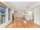 Spacious living room featuring hardwood floors, large windows, and a cozy fireplace at 1030 Jersey St # 1, Denver, CO 80220