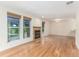 Bright, open living room with natural light, a fireplace, and lovely hardwood floors at 1030 Jersey St # 1, Denver, CO 80220